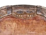 a wooden plaque with a lion head on it