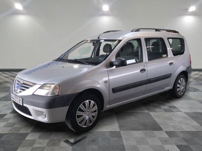 a picture of a silver car parked in a garage