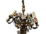 a chandelier with a bunch of flowers hanging from it