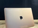 an apple macbook pro laptop sitting on top of a wooden table