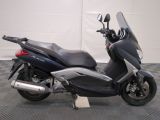 a picture of a motorcycle parked on a checkered floor