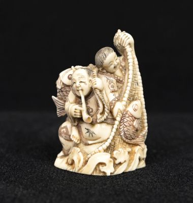 a close up of a statue of an elephant on a black surface