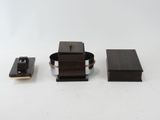 three pieces of wood and metal on a white surface