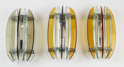 three surfboards are lined up against a white background