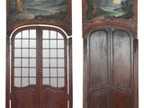 pair of antique painted wood doors with arched glass panels
