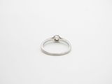a close up of a ring on a white surface