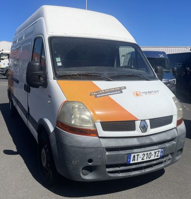 a white van with orange stripes parked in a parking lot