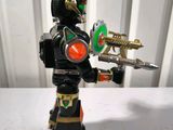 the toy figure is holding a toy gun and a toy gun