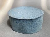 a blue hat sitting on top of a table