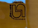a close up of a glass with a logo on it