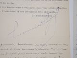 two pages of a book with a handwritten letter and a picture of a man
