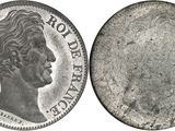 a close up of a coin on a white background