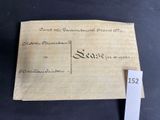 an old envelope with a stamp on it sitting on top of a table