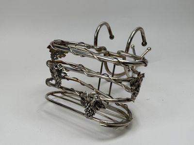 a metal wire holder with a bunch of hooks on it