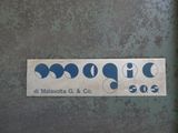 a sign on the door of a building that says moogie