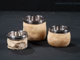 three different types of dog bowls on a black surface