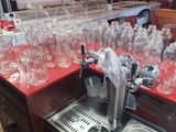 a lot of empty glass bottles on a red counter