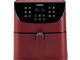 an image of a red air fryer sitting on top of a white surface