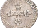 an image of a silver coin with a cross on it