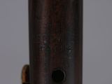 an image of a close up of a wooden pipe on a table