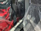 a seat in the back of a vehicle covered in plastic