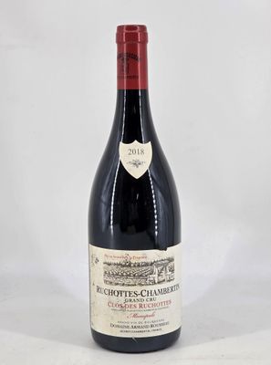 bottle of red wine with a white label on a white background