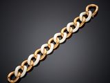 a gold and white link bracelet