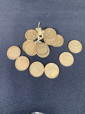 a lot of coins that are on the table