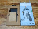 packaging of a phone in a cardboard box on a wooden table