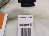 a label on a white shirt that says timberland