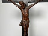 jesus on the cross on a black stand with a white background