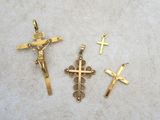 three crosses and a crucif cross on a table