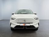 the front view of a white car in a white room