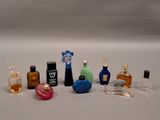 a lot of small bottles of perfume on the table