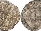 a silver coin with a crown on the front and a shield on the back