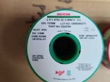 two spools of red and green thread in a box
