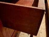 a drawer that is sitting on a table in a room