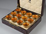an open box with a set of twelve glass cups in it