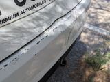 a white car parked on the side of the road