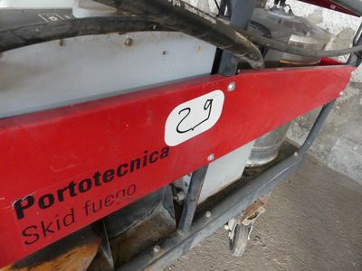 a picture of a red and black skid machine