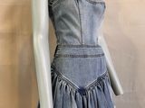 denim dress with ruffles on mannequin base