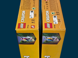 two boxes of lego creators sitting on a table