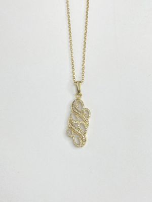 a gold necklace with a snake on it