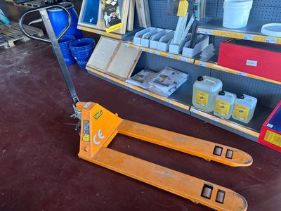 a fork lifter sitting on the floor in a store