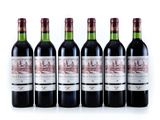 six bottles of red wine lined up in a row
