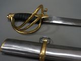 two swords that are on display on a table