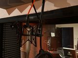 a microphone in the corner of a recording studio