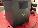 a dell computer sitting on a red table in a store