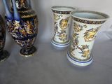 three vases sitting next to each other on a table