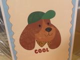 a picture of a card with a dog wearing a hat on it